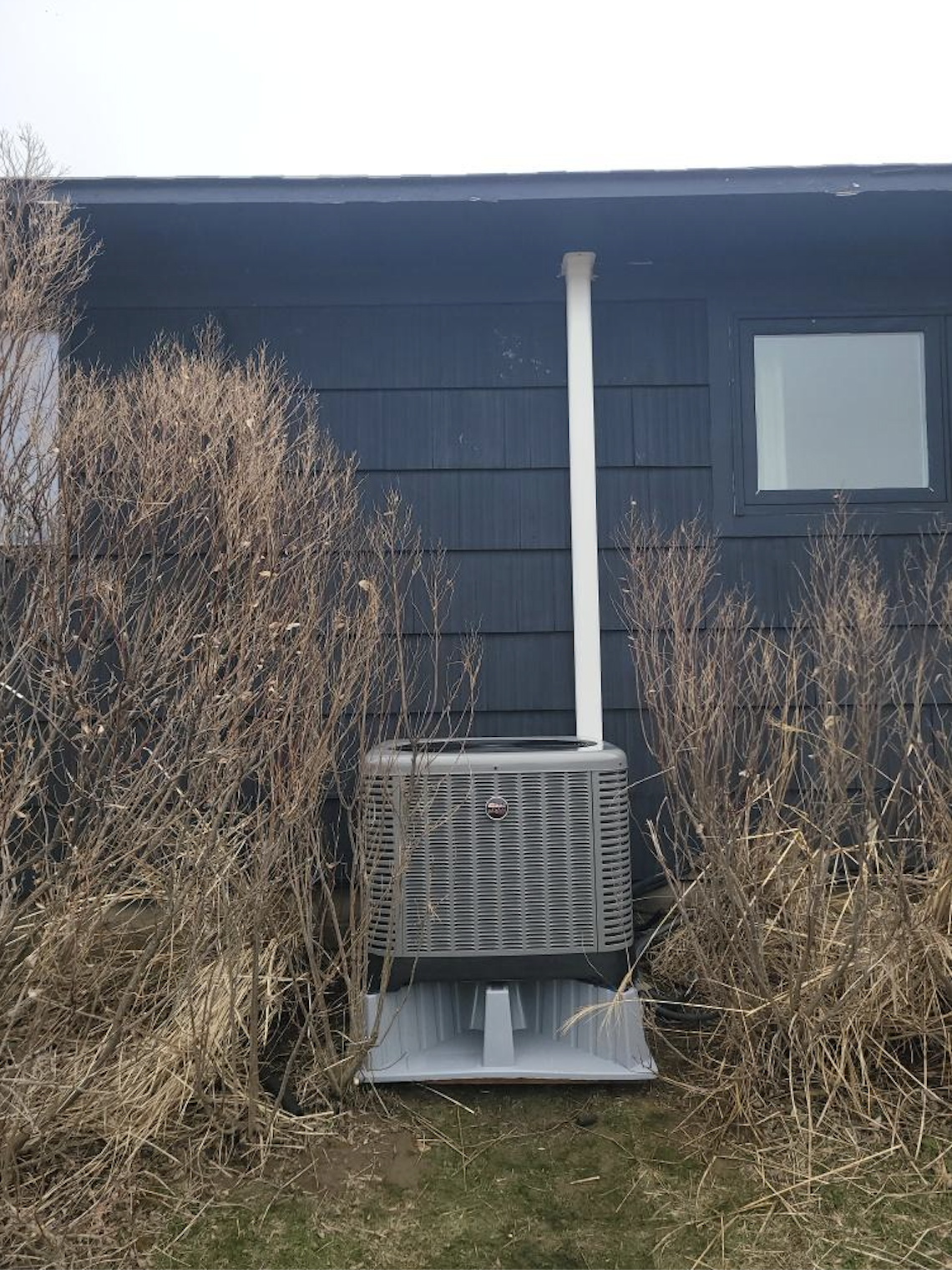 High-efficiency AC condenser with custom condensate piping