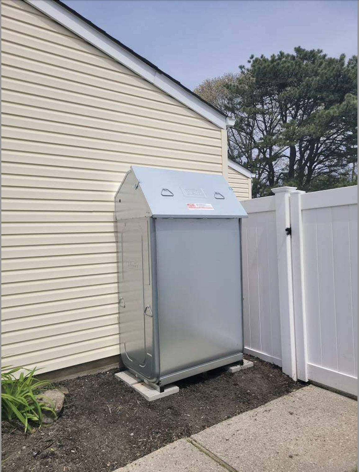 Whole-home standby generator installed beside house